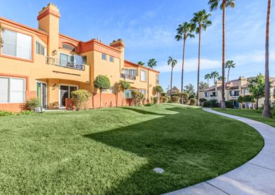 grass area and pathway through arezzo apartments