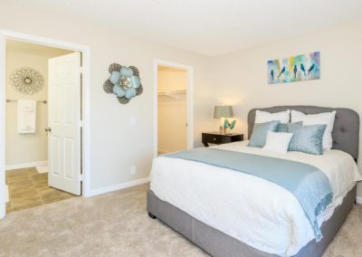 bedroom with bathroom and closet at arezzo apartments