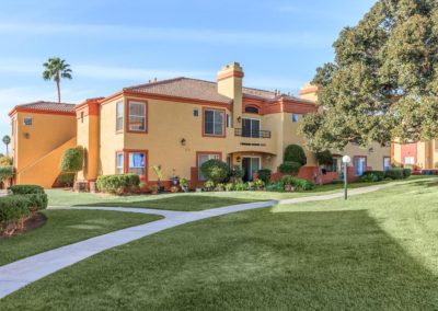 grass area and exterior of arezzo apartments