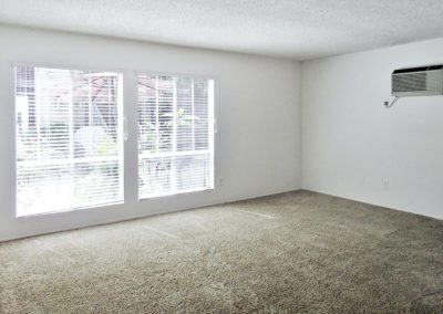 living area with carpet at arizona towers