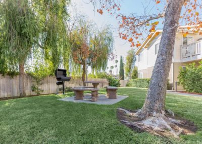 outdoor lounge area with barbeque at citrus court