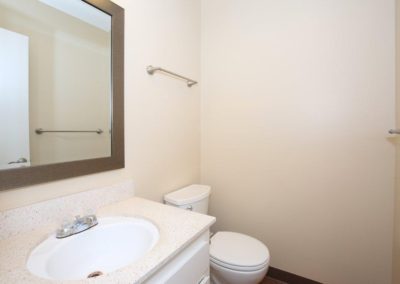 bathroom with sink and toilet at city gardens