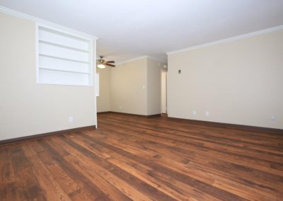 living area with storage and ceiling fan at city gardens