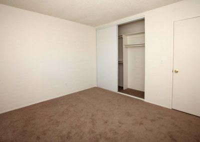 carpeted bedroom and closet at the courtyards