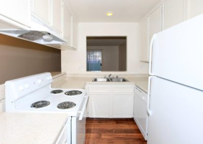 emerald vista kitchen with sink, stove, and refrigerator