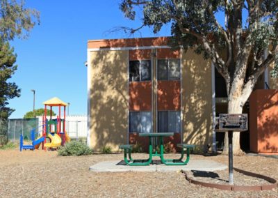 emerald vista outdoor area with playground and barbeque