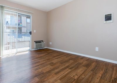 living area with air conditioner and sliding glass door at euclid oaks