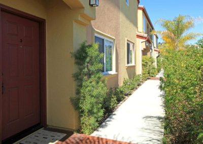 front porch and pathway with greenery