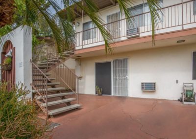 stairway to second floor and front patio of unit at la mesa palms