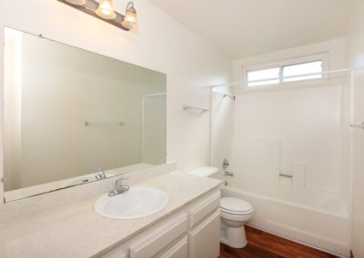 landmark gardens bathroom with sink toilet and shower