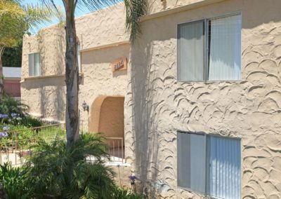 exterior of lemon gardens with palm trees