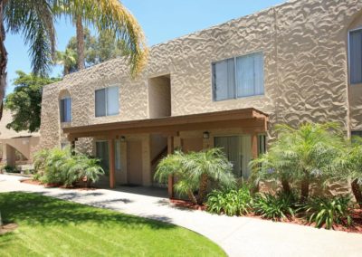 exterior of lemon gardens with palm trees