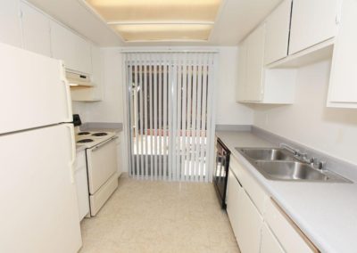 kitchen with sliding glass door at lemon gardens