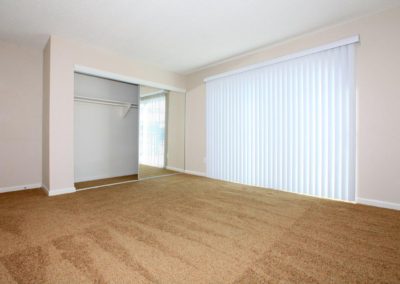 bedroom with closet sliding glass door at maple view