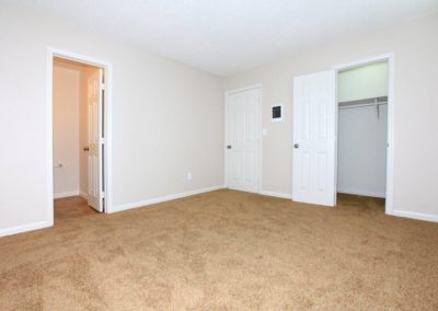 bedroom with bathroom and closet at mapleview