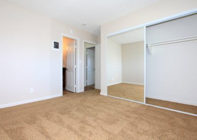 bedroom with bathroom and closet at maple view apartments