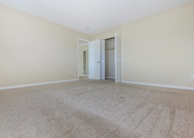 bedroom with carpet and closet at fresno terrace