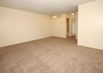 carpeted living area at the pines