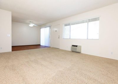 living area with air conditioner at the pines