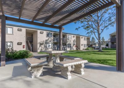 courtyard with seating at the pines apartments