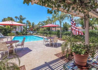 pool deck area with seating at pinewood villas