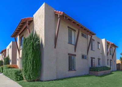 exterior and grass area at portofino apartments