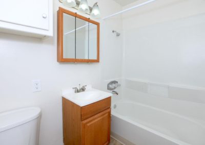 bathroom at nisi apartments with sink and shower