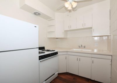 kitchen with refrigerator stove and sink at oceanridge apartments