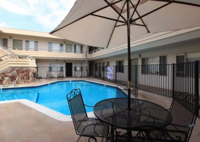 pool area with seating and umbrella at oceanridge