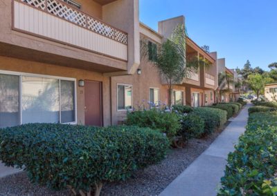 parklane apartments exterior walkway with landscape