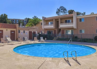 parklane apartments pool area with lounge chairs