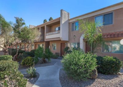 parklane apartments exterior path with landscape