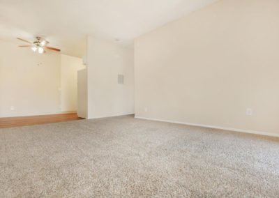 living area with carpet at peppertree gardens apartments