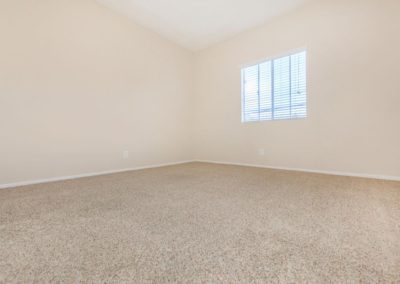 bedroom with window at peppertree gardens apartments