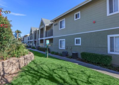 exterior and pathway through peppertree gardens apartments