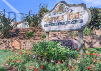 front entrance sign at peppertree gardens apartments