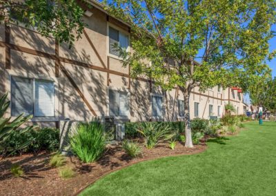 exterior and grass area at pepper valley apartments