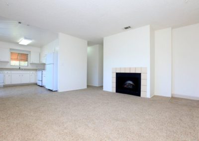 living area with fireplace at pepper valley apartments