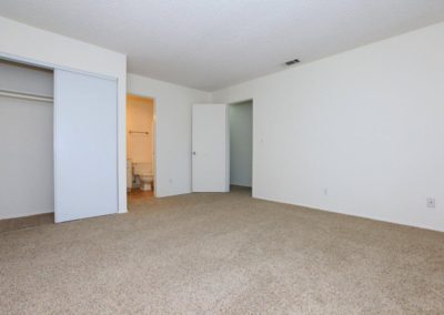 bedroom with bathroom and closet at pepper valley apartments