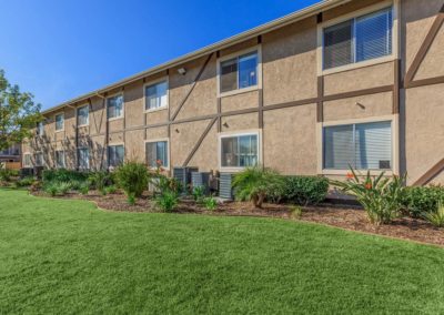 exterior and grass area at pepper valley apartments