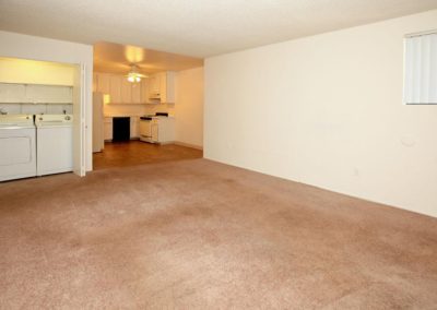 living area with kitchen and laundry at ridgewood court