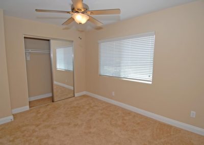 carpeted bedroom with closet at taft manor