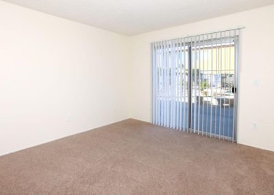 living area with sliding glass door at greentree apartments