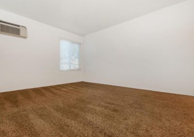 carpeted bedroom with window at lake meadows