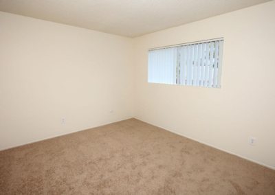 carpeted bedroom with window at parks ave.