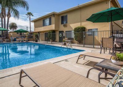 pool area with lounge seating at parks avenue