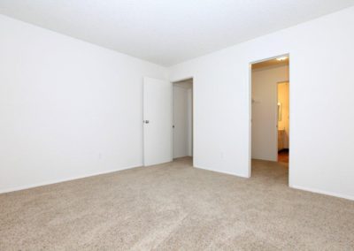 bedroom with closet and bathroom at town and country gardens