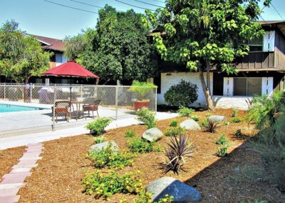 landscape and gated pool area at town and country gardens