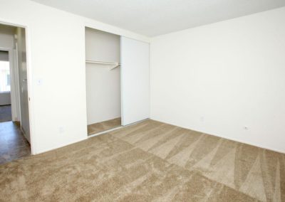 carpeted bedroom with closet at villa montecito