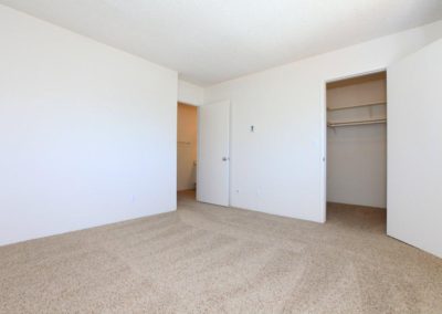 bedroom with bathroom and closet at wells avenue